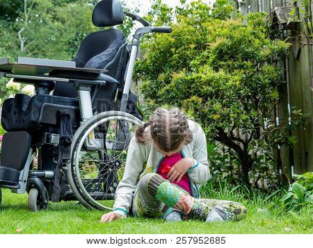 Disability A Disabled Child Relaxing In The Garden