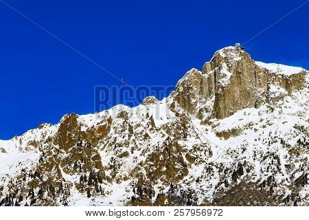 Winter Mountain Ski Travel Vacation Background. Cable Car Tram Cabin, High Snow Mountain Peaks Panor