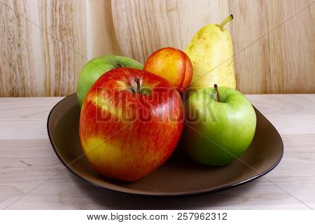 Beautifully Laid Out Fresh Summer Fruits On A Background Of Cutting Boards