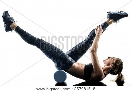 one caucasian woman exercising pilates fitness foam roller exercises isolated  silhouette on white background
