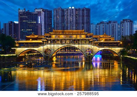 Famous landmark of Chengdue - Anshun bridge over Jin River illuminated at night, Chengdue, Sichuan , China