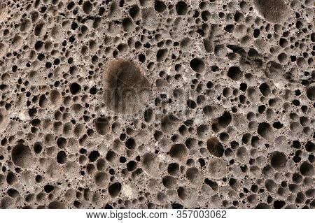 Surface Of Brown Pumice - Closeup. Pumice Brown Sponge Texture For Body Wash. High Resolution Photo.