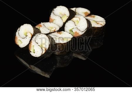 Various Sushi, Rolls On A Black Background With Reflection. Especially For Cafes And Restaurants
