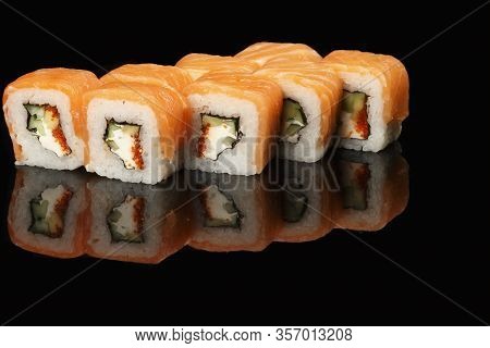 Various Sushi, Rolls On A Black Background With Reflection. Especially For Cafes And Restaurants On 