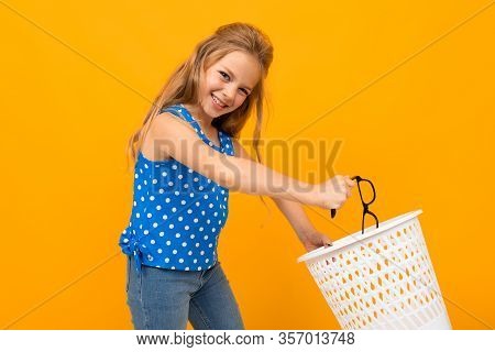 Portrait Of Young Caucaian Girl With Long Fair Hair Hates Her Glasses