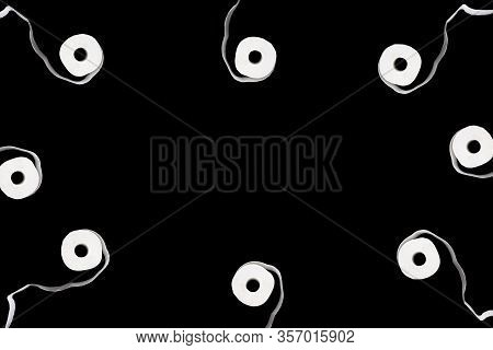 Creative Frame Made From Toilet Paper Rolls. Unwound Roll Of Toilet Papaer Isolated On Black Backgro