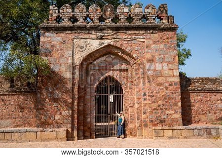 Blond Tourist Poses At The Gate Of Tomb Of Sikandar Lodi, A Ruler Of The Lodi Dynasty In Lodi Garden
