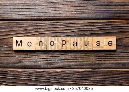 Menopause Word Written On Wood Block. Menopause Text On Table, Concept