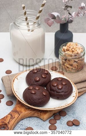 Chocolate Chip Cookies With Glass Of Milk On Gray Background
