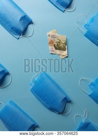 Mexican Banknote Of 200 Pesos And Masks On The Blue Background