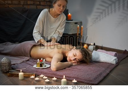 Relax And Enjoy Spa Salon Getting Massage Professional Masseur Woman Lying Naked Back Relax On Floor