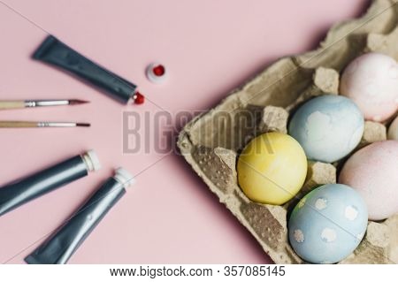 The Concept Of Coloring Easter Eggs In Pastel Watercolor Colors. Paints And Brushes For Coloring Egg