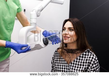 Dentist Makes X-ray Of The Dental Cavity For The Patient In Clinic