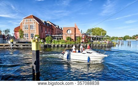 Malchow, Germany - July 9, 2017: Modern Motor Yacht Sails On The Lake At Malchow In Mecklenburg-vorp
