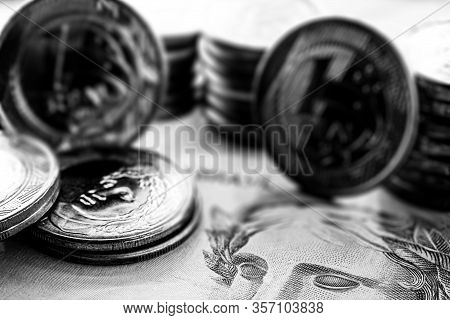 Image Of Money From Brazil, Banknotes Of 100 Reais And Coins, With Contrast And Shadows. Concept Of