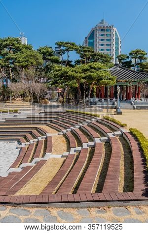 Daejeon, South Korea; March 16, 2020: Amphitheater Seating In City Park With Oriental Pavilion And S