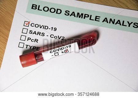 Result Form And Blood Sample Test Tube Positive With Covid-19 Or Novel Coronavirus