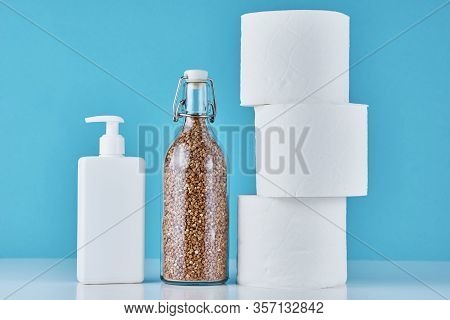 Consumer Buying Panic About Coronavirus Covid-19 Concept. Toilet Paper Roll, Buckwheat And Sanitizer