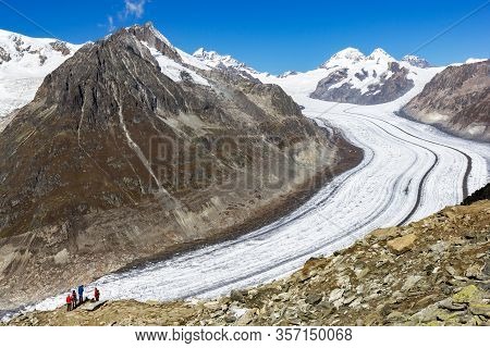 Fiesch, Swizterland: 25 September 2017 - Hikers Viewing The Great Aletsch Glacier - Largest European