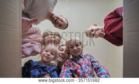 A Large Family Opens The Parcel And Find The Manjarins.