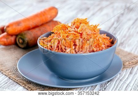 Frozen Grated Carrots. Harvesting Vegetables For The Winter. Frozen Vegetables Close-up.