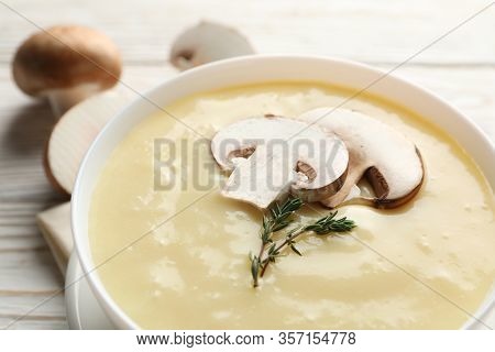Mushroom Cream Soup On Wooden Background, Close Up