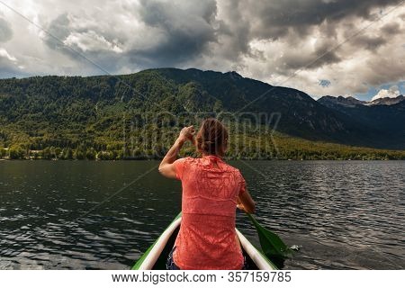 Girl Kayaking In The Scenic Bohinj Lake, Slovenia