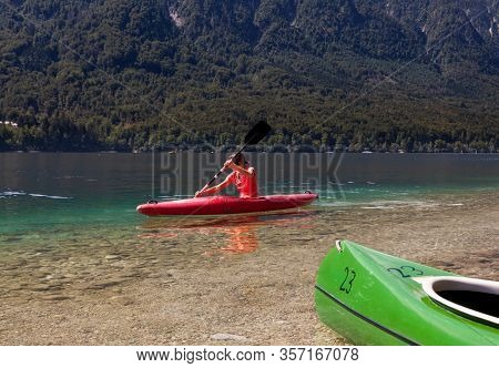 Girl Kayaking In The Scenic Bohinj Lake, Slovenia
