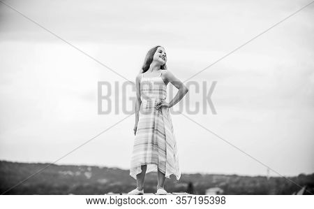 Good Mood At Any Weather. Carefree Child In Summer Dress. Small Girl With Long Curly Hair. Childhood