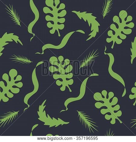 Green Leaves Of Plants On A Dark Background