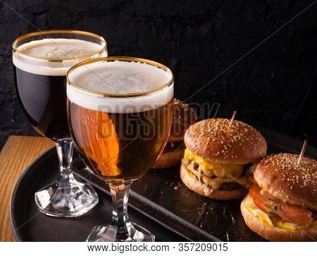 Cold Beer In A Glass And A Snack In The Form Of Juicy Large Burgers. Fast Food.