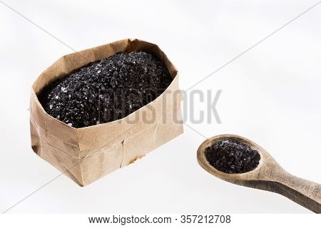 Hawaiian Black Salt In Paper Bag. White Background