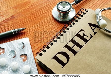Dehydroepiandrosterone Dhea Hormone And White Pills With Pen.