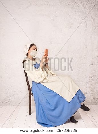 Medieval Young Woman As A Medieval Lady Milkmade Wearing Protective Face Mask Against Corovanirus Sp