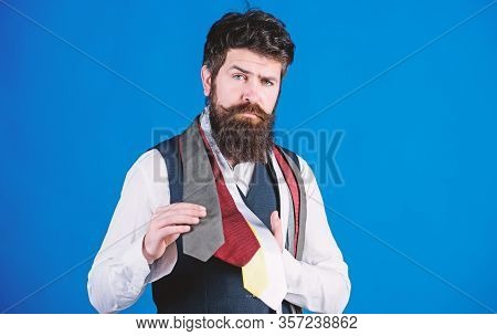 It Is A Perfect Choice Neckwear. Salesman Offering A Good Choice Of Design Neckties. Bearded Man Cho