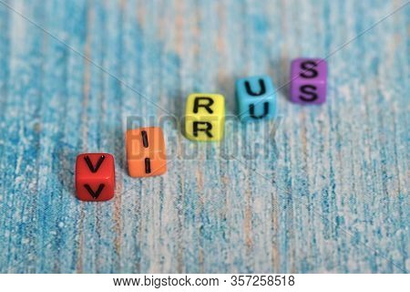 The Inscription Virus In Colored Letters On A Blue Background.