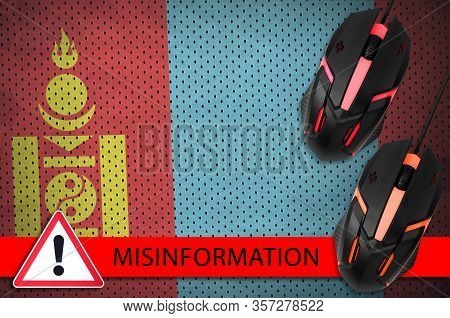 Mongolia Flag And Two Computer Mouses. Misinformation During Coronavirus Or 2019-ncov Virus Concept