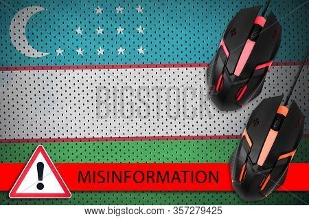 Uzbekistan Flag And Two Computer Mouses. Misinformation During Coronavirus Or 2019-ncov Virus Concep