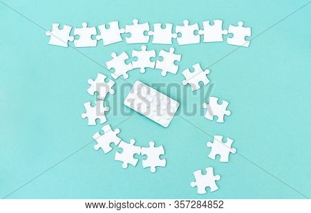 Row and circle around pills made from white puzzle pieces