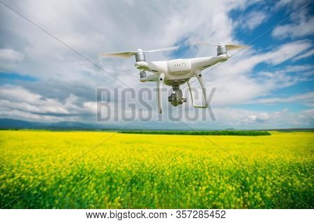 Flying Drone Over The Rapseed At Spring