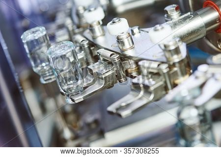 pharmaceutical industry. medicine glassware bottles washing in cleaning machine