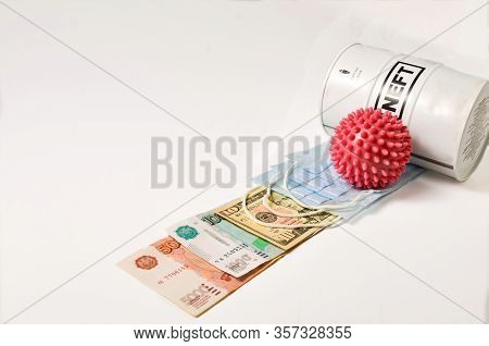 A Barrel Labeled Oil And Spiked Balls Imitating A Coronavirus Are Punished With Money From Different