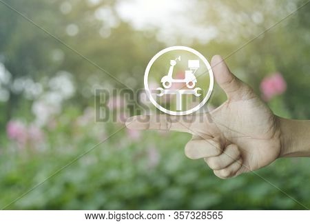 Hand Pressing Service Fix Motorcycle With Wrench Tool Flat Icon Over Blur Pink Flower And Tree In Ga