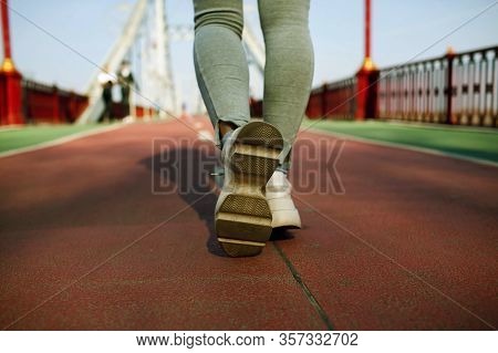 Close Up Young Fitness Woman Hiker Legs On The Bridge. Sport Healthy Lifesty
