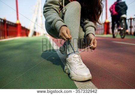 Close Up Young Fitness Woman Hiker Legs On The Bridge. Sport Healthy Lifesty