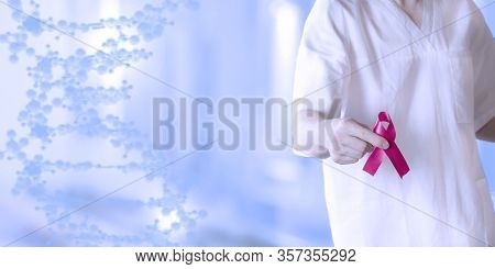 Doctor In White Uniform Holds A Red Ribbon-symbol Of The Fight Against Disease Aids And Vasculitis, 