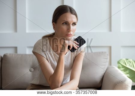 Upset Pensive Woman Holding Phone, Waiting For Call, Feeling Lonely