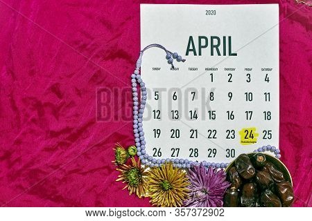 April Monthly Calendar On The Red Silk Textile Background. Islamic Ramadan Eid Festive Background Wi