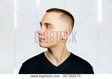 Portrait Of Young Man With Caesar Hair Cut, Side View.