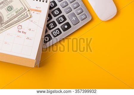 April Of The Year Is Tax Day, Top View Flat Lay Closeup Calculator, Laptop Computer, Calendar, And D